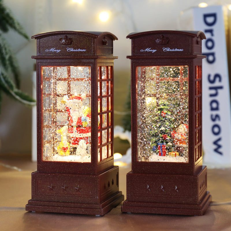 Telephone booth design holding a small Christmas tree inside it