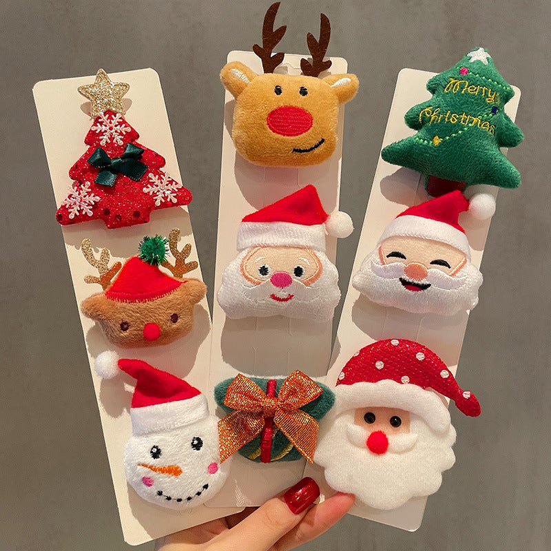 Fabric Christmas brooch pin range shown across twenty nine cloth holiday designs