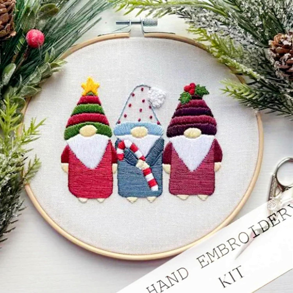 Flat embroidery stitching on a printed Christmas fabric panel