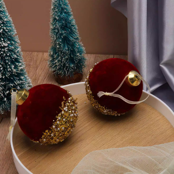 Deep wine toned red glass bauble with a velvet like finish