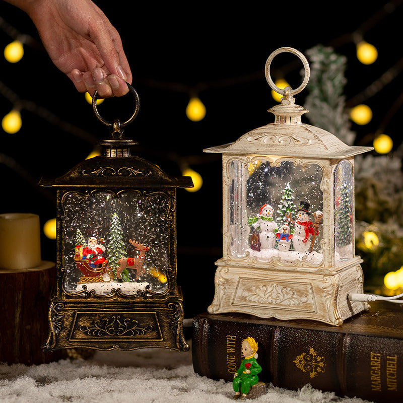 Christmas crystal ball music box with a resin figure holding the clear ball