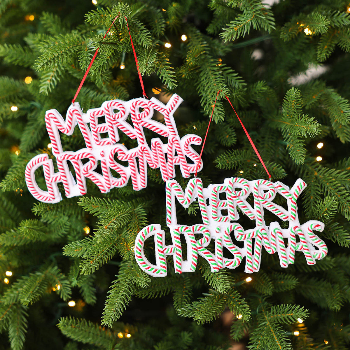 Molded plastic Christmas ornament shaped as a Merry Christmas lettered plaque