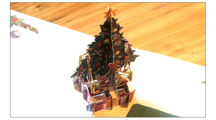 Folding Christmas card with a blank panel for a written message