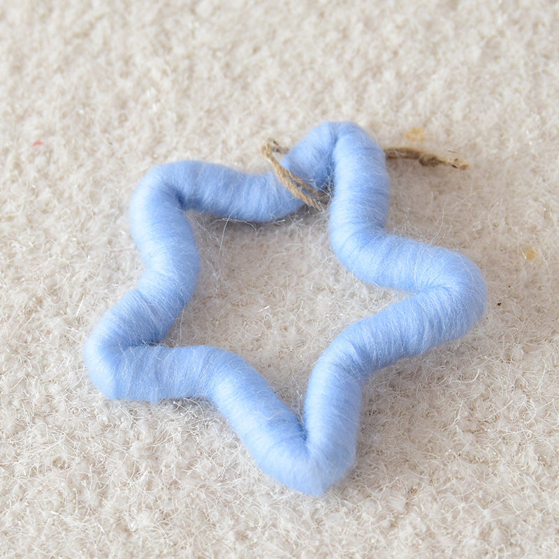 Wool felt snowflakes and stars offered in five color and shape pairings