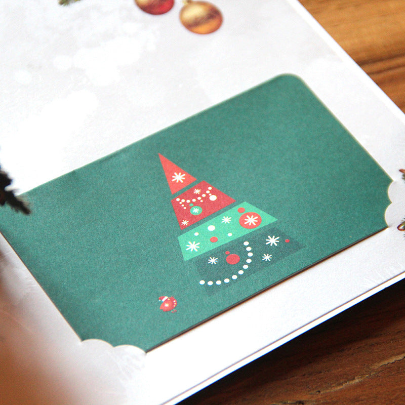 Layered paper Christmas tree card with light passing between branches