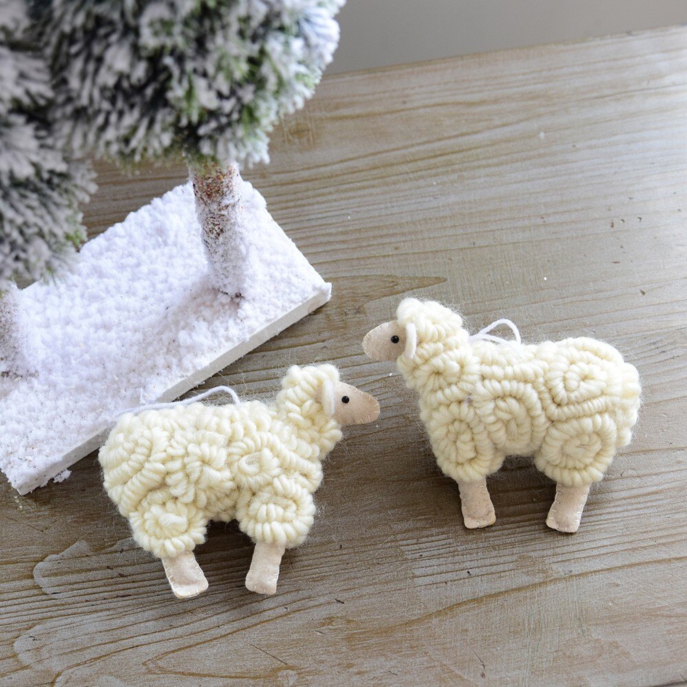 Wool felt sheep ornament measuring 5.5 by 4.7 inches