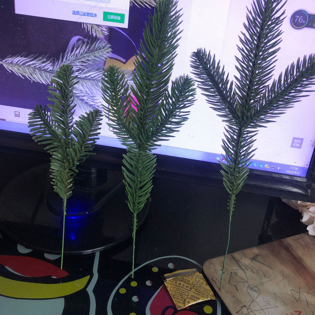Artificial green pine needle picks for filling gaps in a Christmas tree