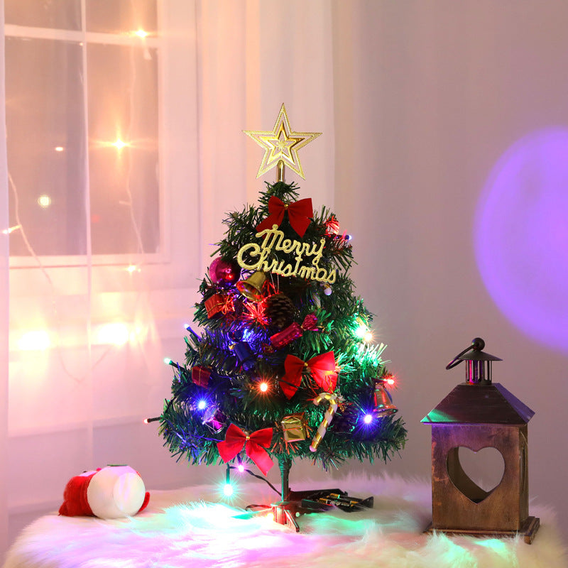 Small artificial Christmas tree supplied singly and packing down for storage