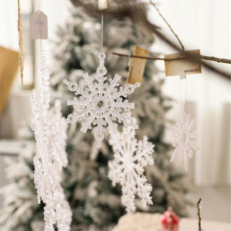 Clear acrylic snowflake Christmas ornament cut with an open flake pattern