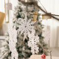 Clear acrylic snowflake Christmas ornament cut with an open flake pattern