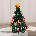 Slim MDF ornament that sits close against a Christmas branch