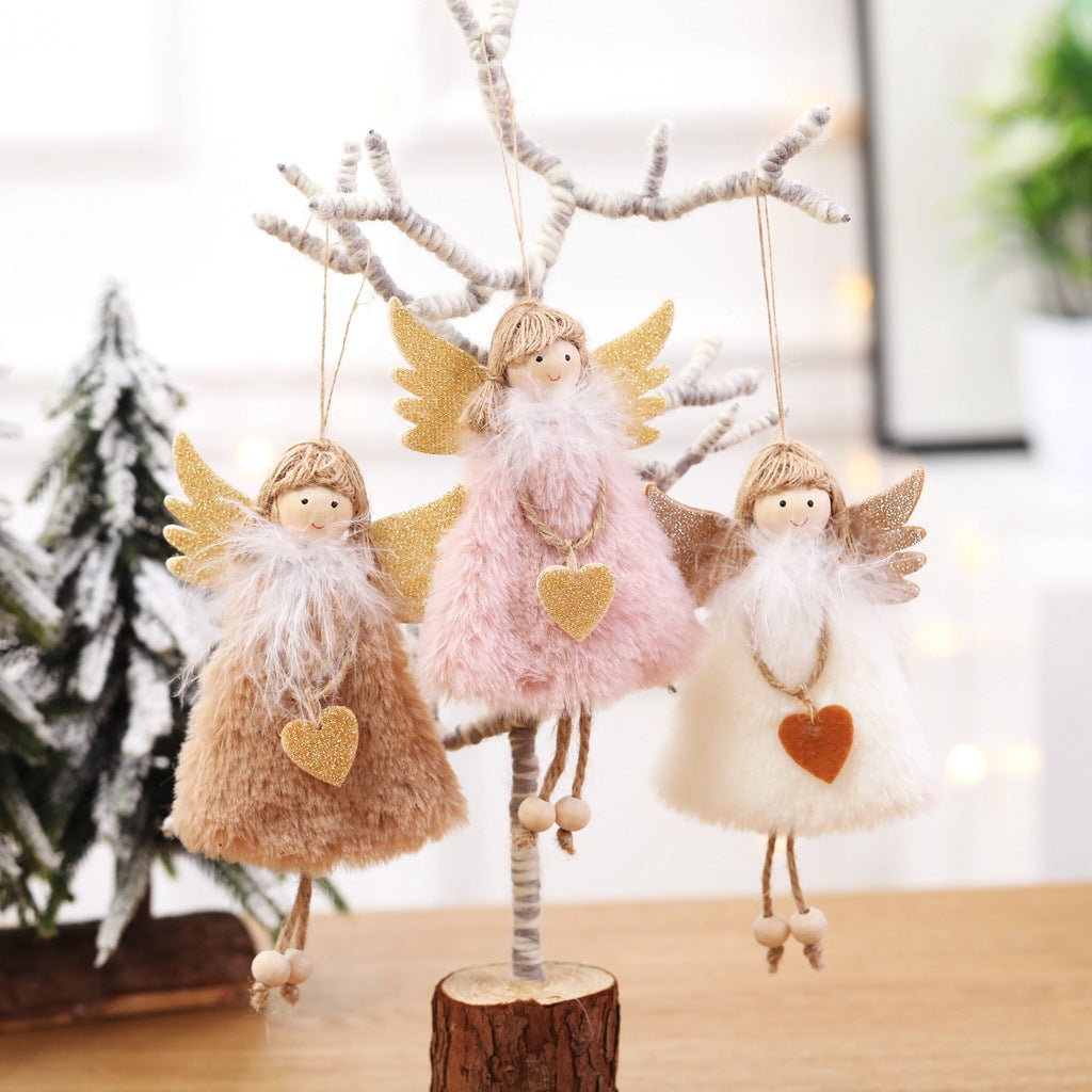 White winged plush Christmas angel ornament made to hang from a branch