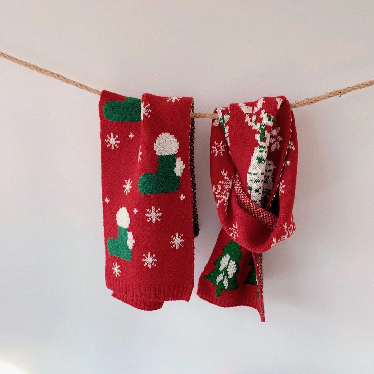Knitted acrylic Christmas scarf with an embroidered deer motif