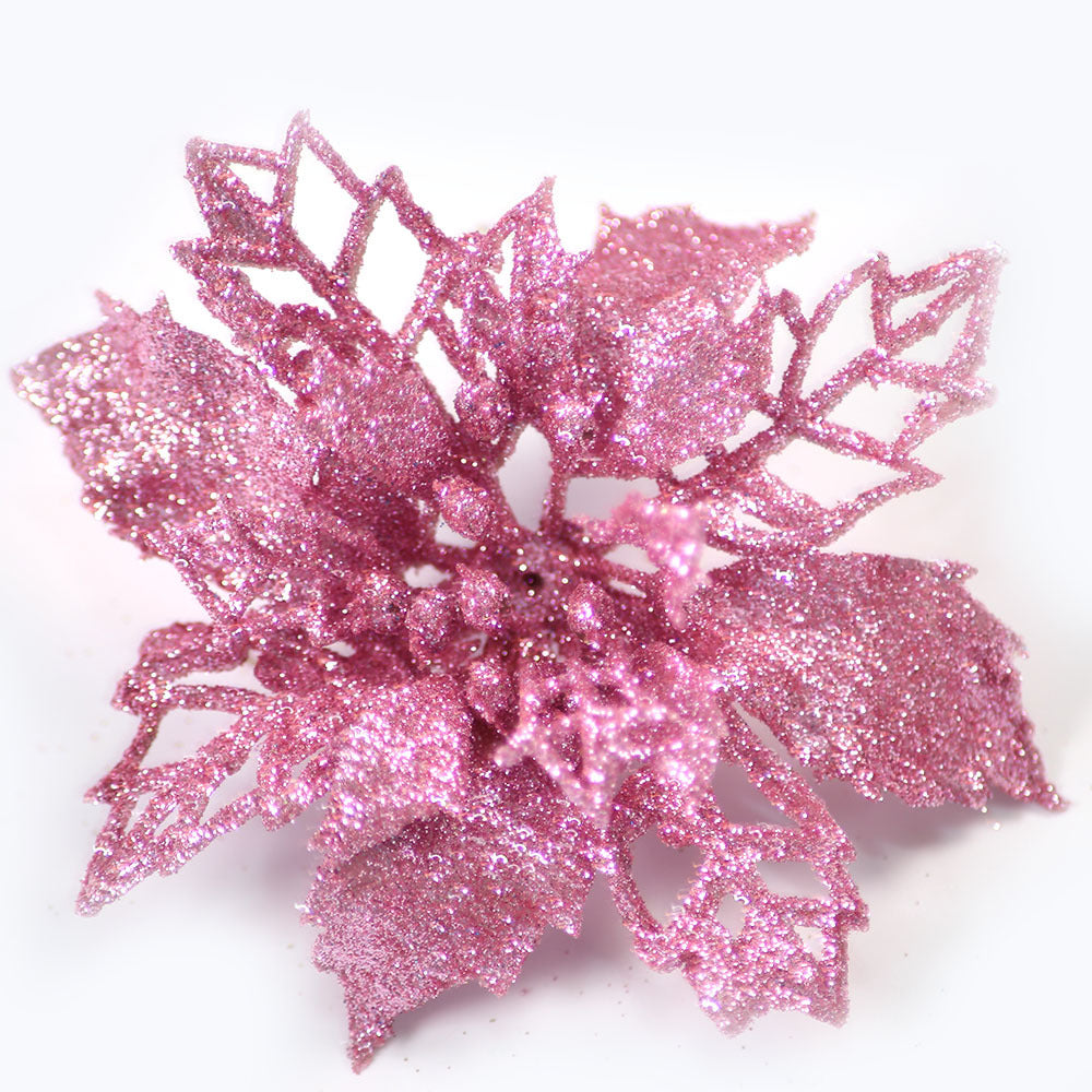 Pink artificial Christmas flower measuring 3.7 inches across