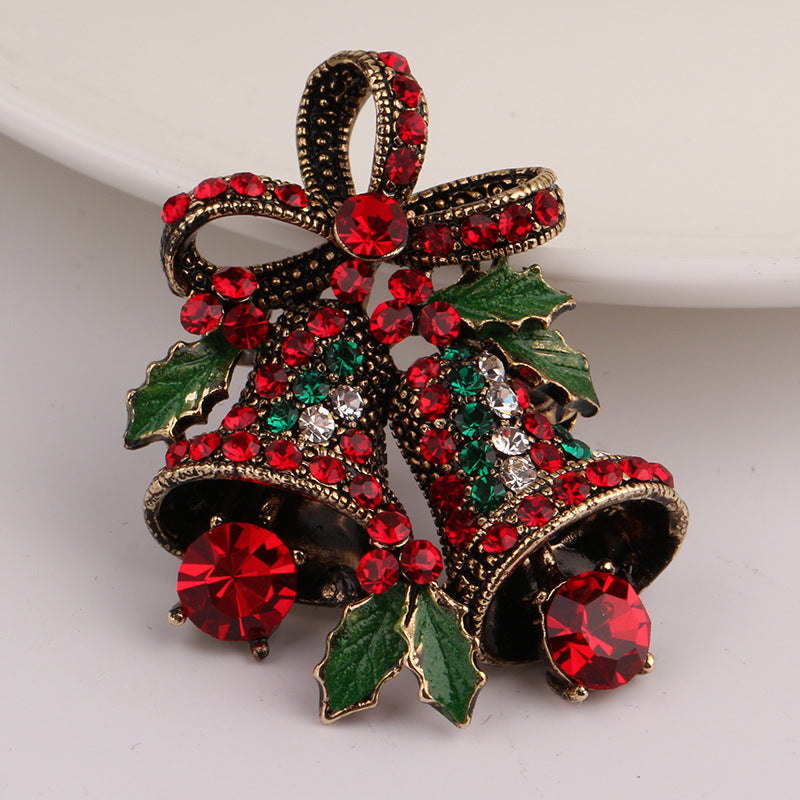 Antique gold alloy Christmas cane brooch set with imitation stones