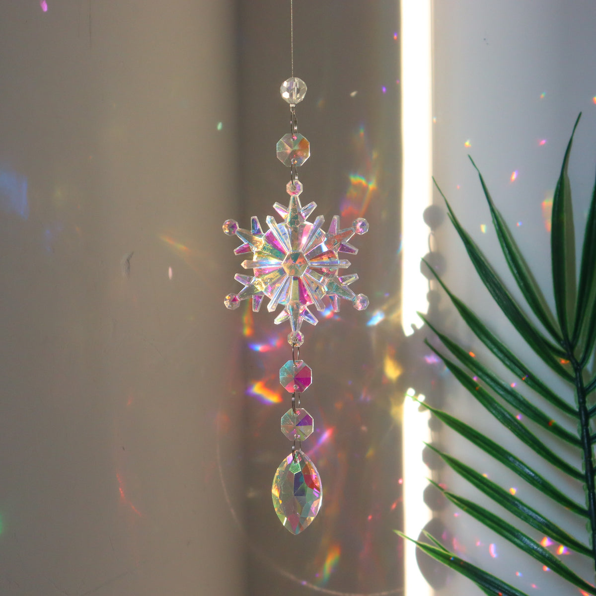 Acrylic beads that shift color as the snowflake hanger turns