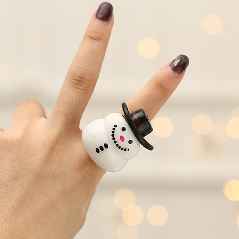 Four Christmas finger light designs: tree, snowman, snowflake and Santa