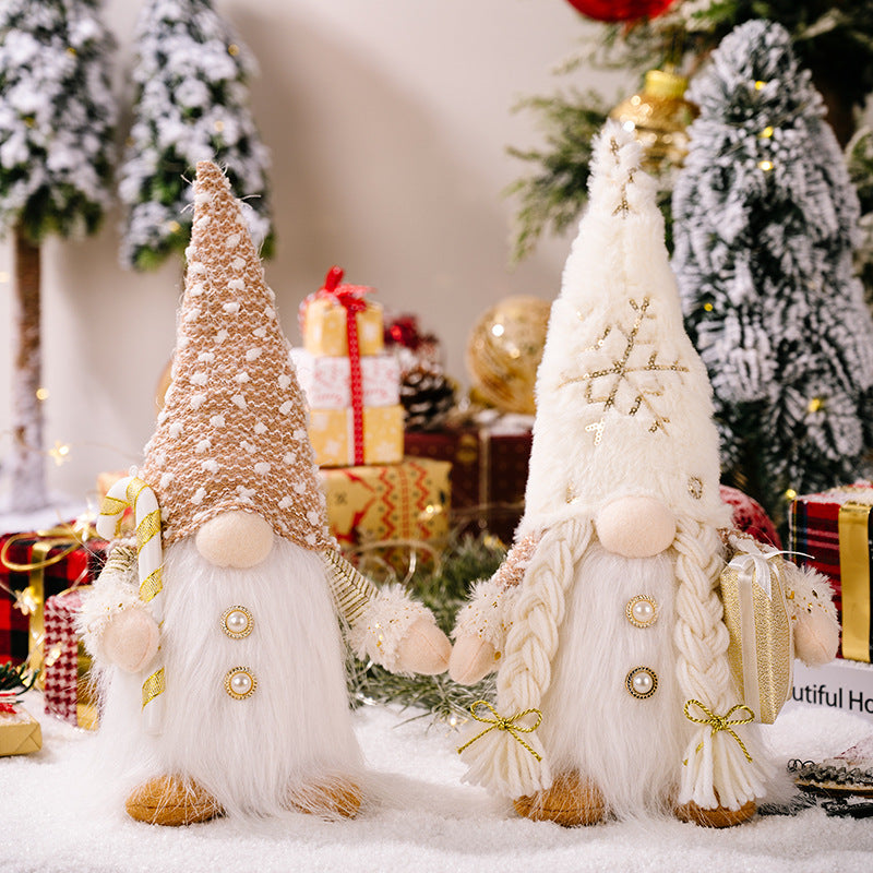 Faceless Christmas doll in cloth with a red hat and long white beard