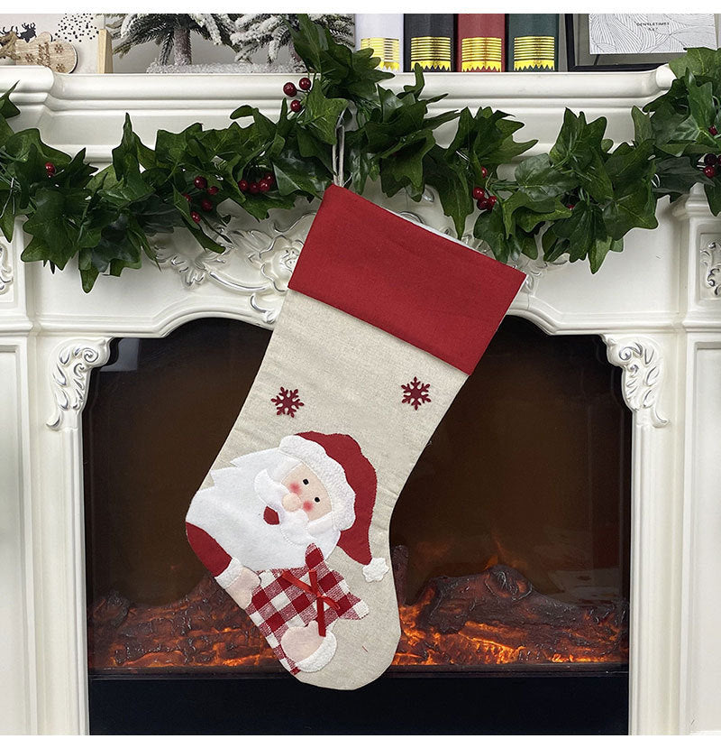 Santa face version of the four character Christmas stocking range