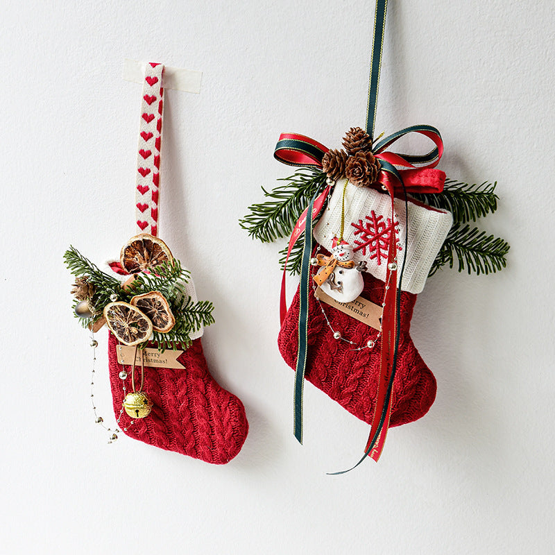 Knitted cloth Christmas stocking with a stitched snowman trim and hanging loop