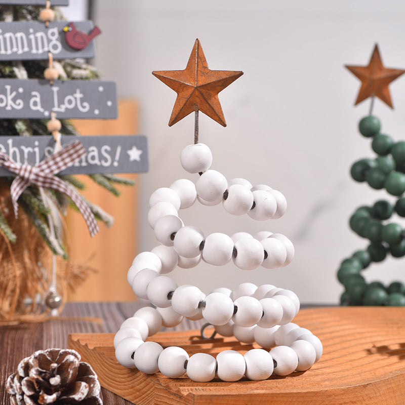 Green wooden Christmas decoration with a wrought iron frame