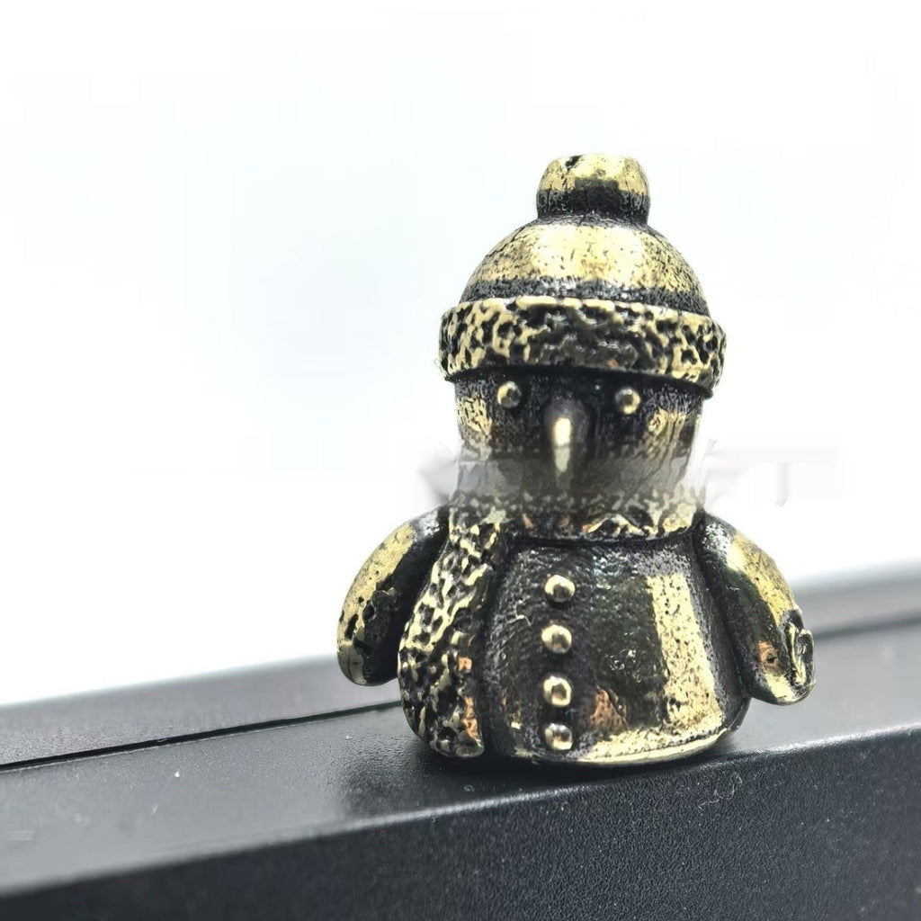 Cut metal ornament that tilts and turns on its hinge