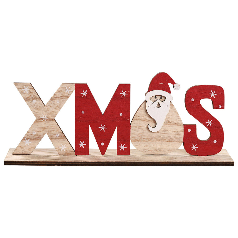Three wooden Christmas word signs: Snow, Xmas and Noel