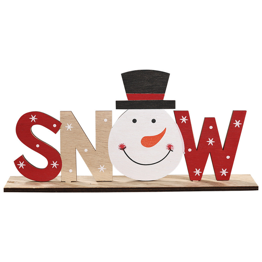 Wooden word ornament ready to hang from a Christmas tree