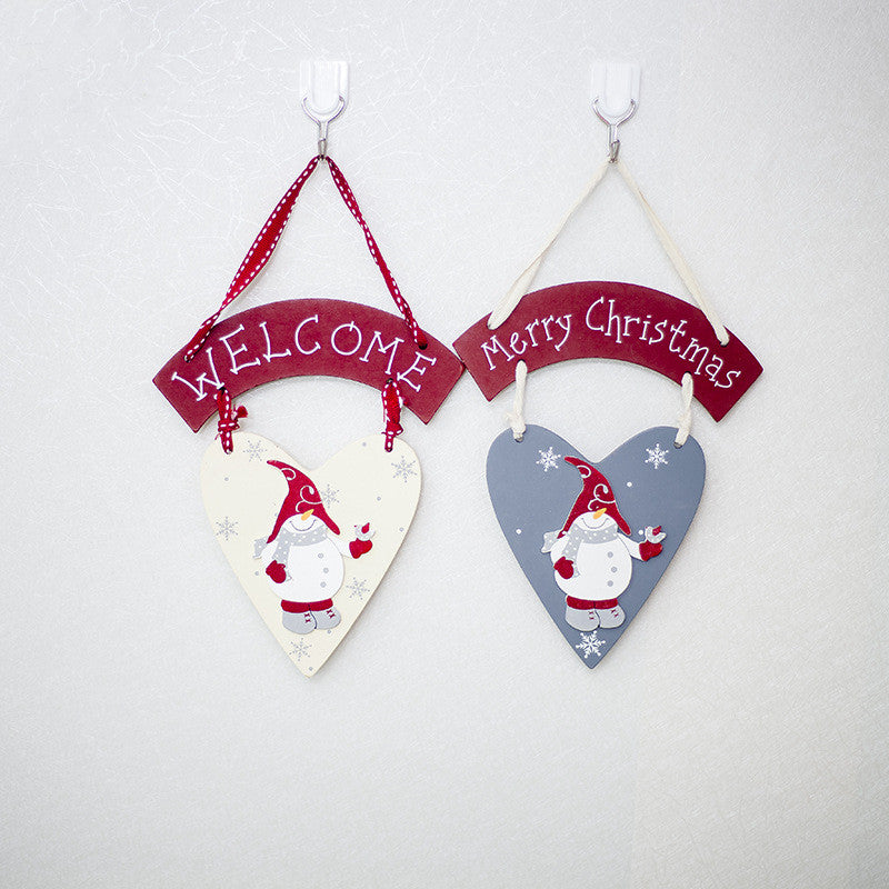 Christmas plaque cut from solid wood with a painted snowman design