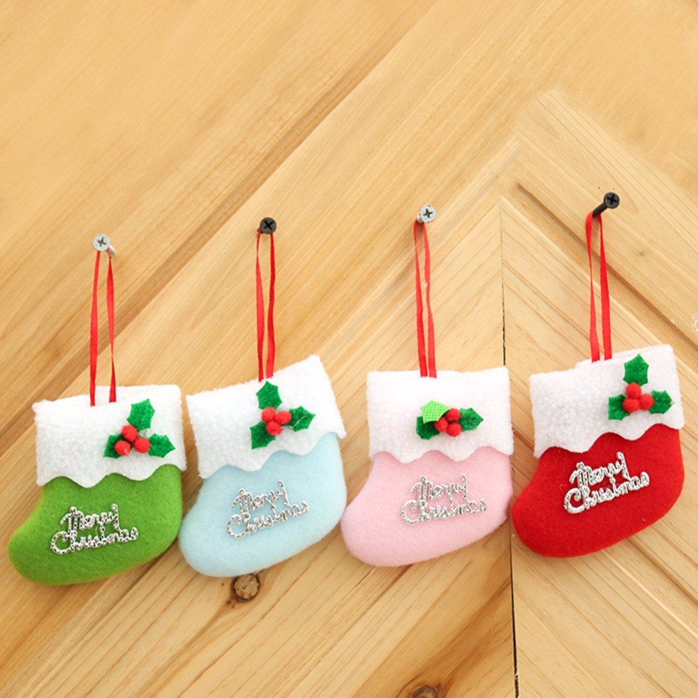 Set of four mini cloth Christmas stockings in red, green, pink and blue
