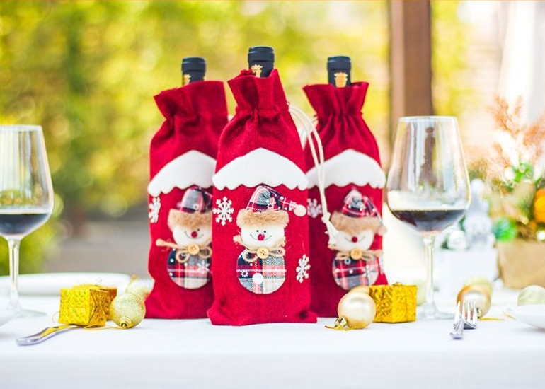Cloth Christmas bottle cover measuring 5.5 by 12.2 inches