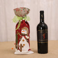 Ribbon tie and printed fabric edge on the Christmas bottle sleeve