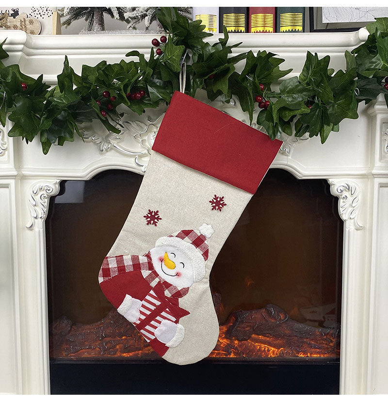 Snowman face Christmas stocking sewn from non-woven velvet cloth