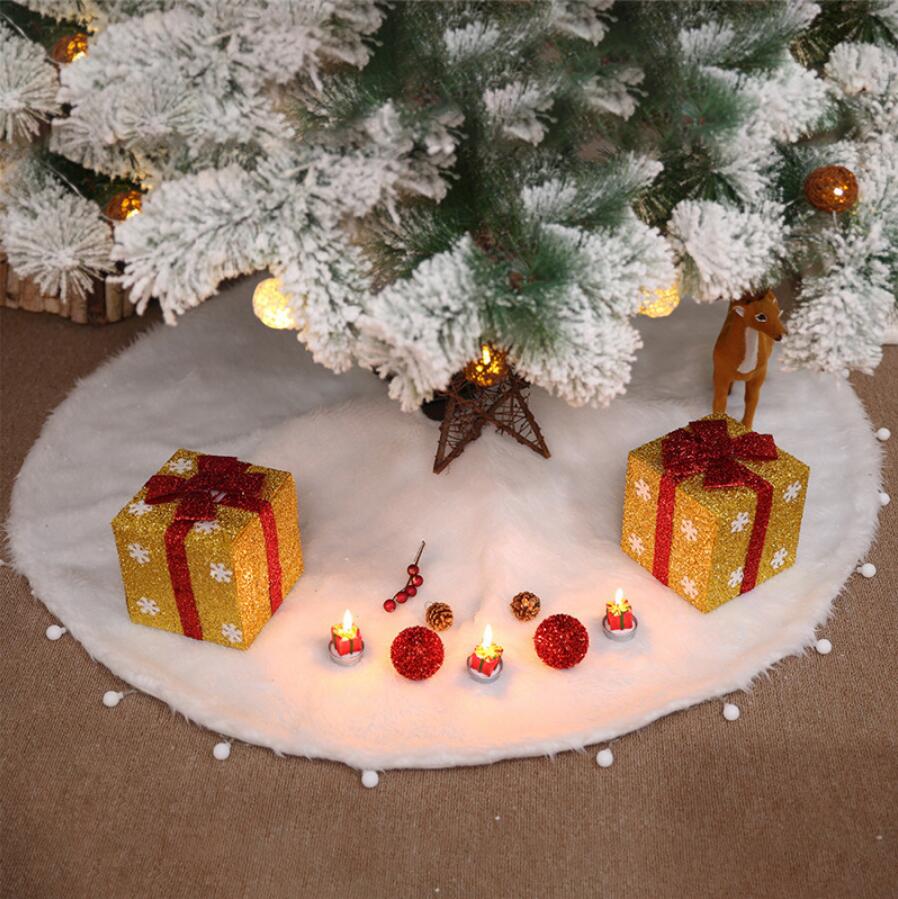 White plush tree skirt with a full circular shape and center opening