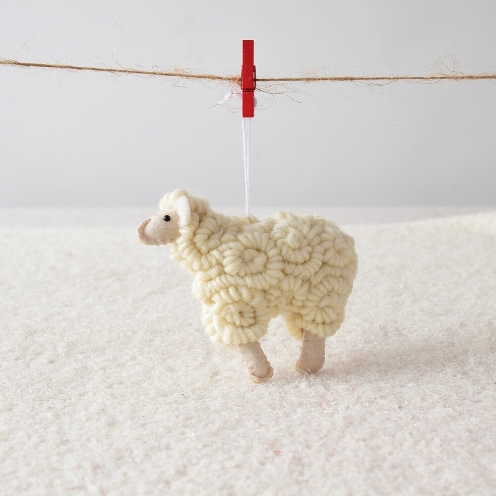 Felt Christmas sheep pendant made from wool felt in a natural shade