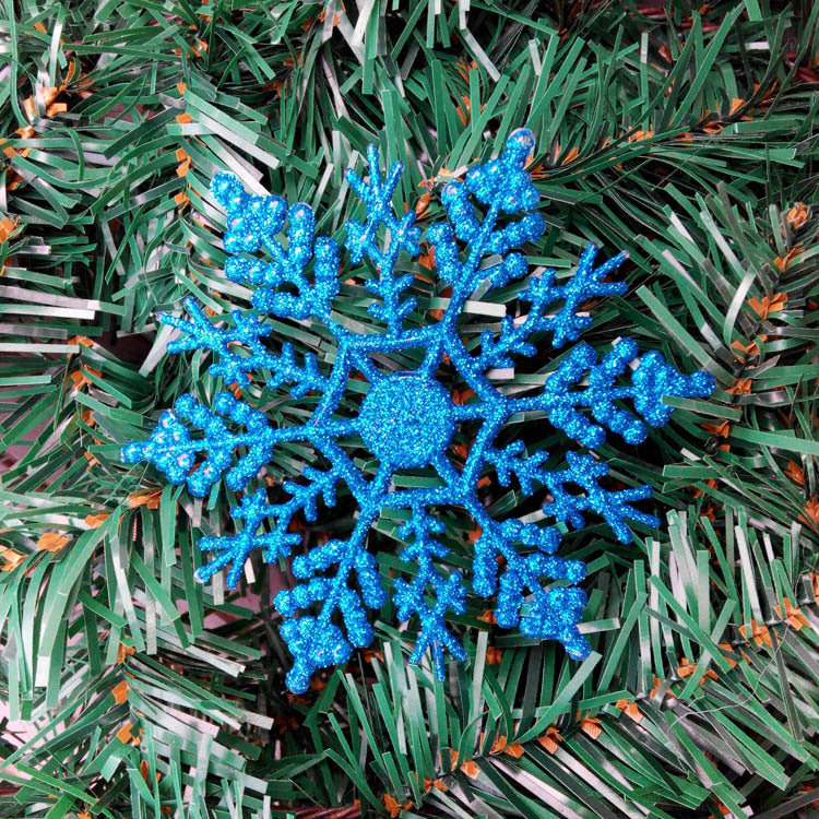 Red acrylic Christmas snowflake weighing about 0.2 ounces