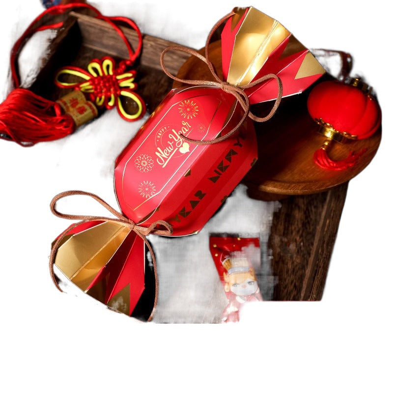 Polka dot Christmas gift box folded from printed kraft paper