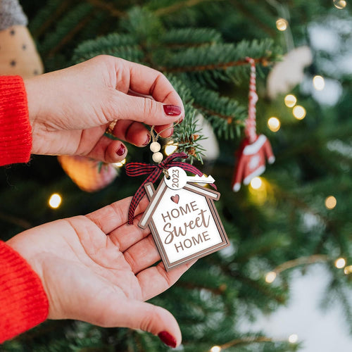 Wooden house Christmas tree ornament built as a three dimensional cabin