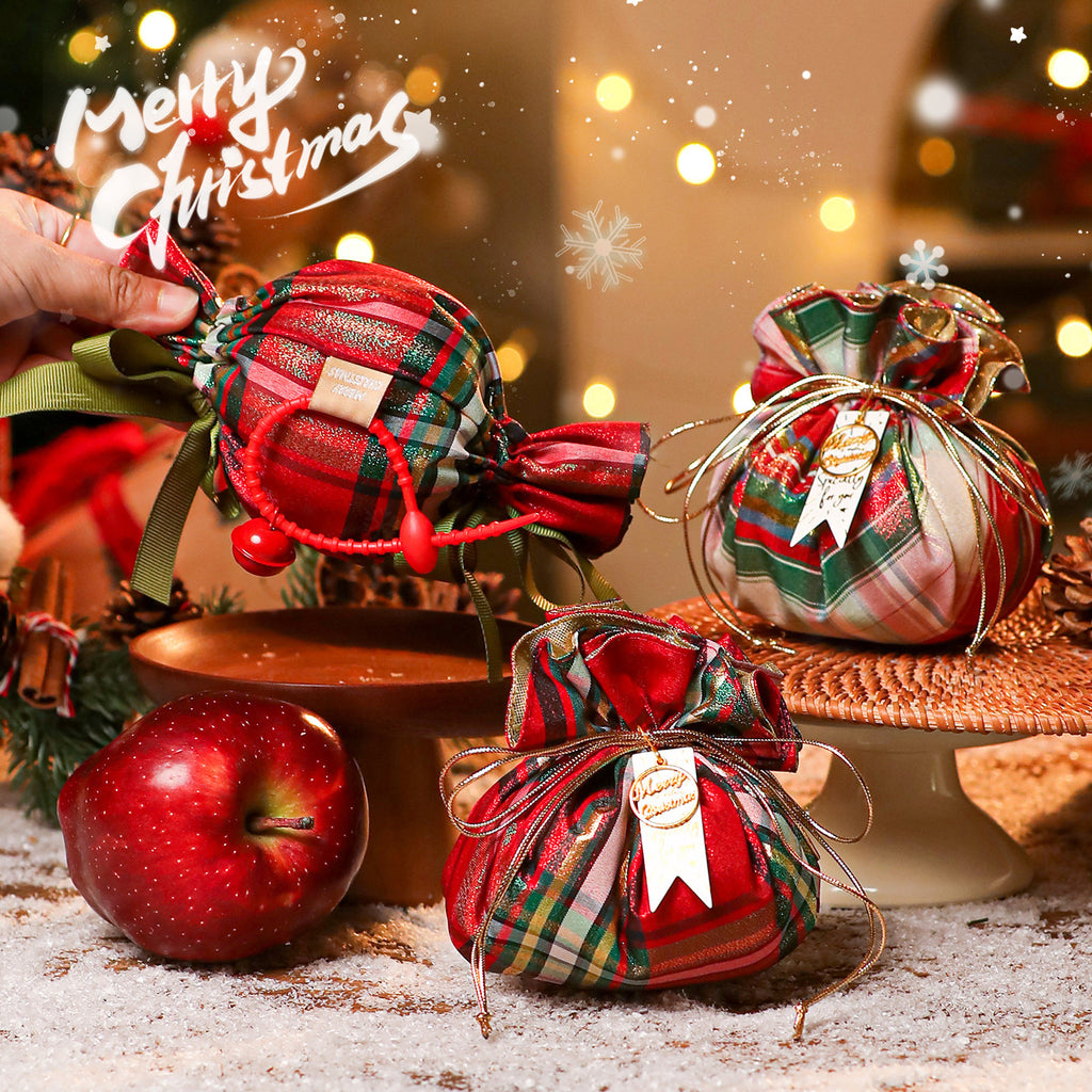 Small red fabric Christmas gift pouch measuring 3.9 by 3.9 inches