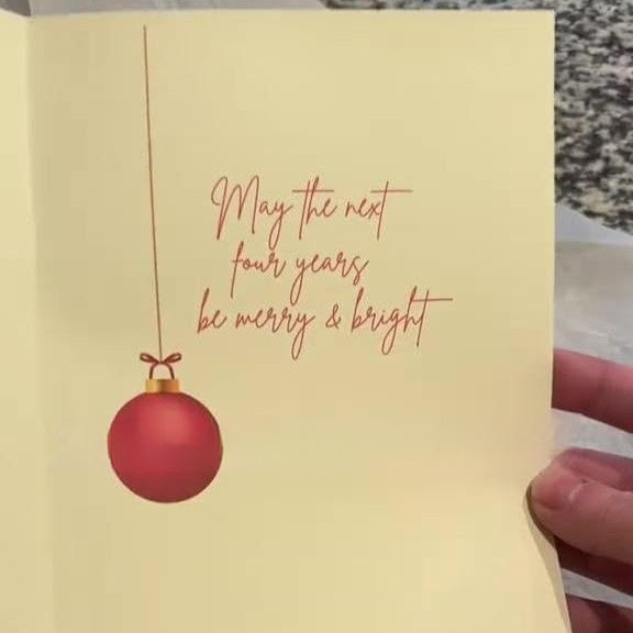 White Merry Christmas card showing the printed front panel