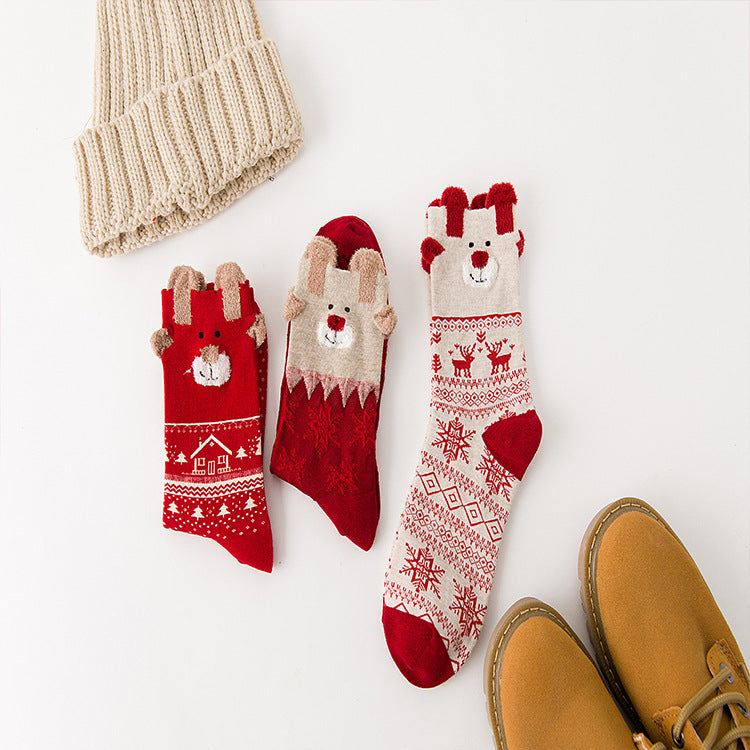 Red snowman patterned Christmas socks in a polyester cotton knit