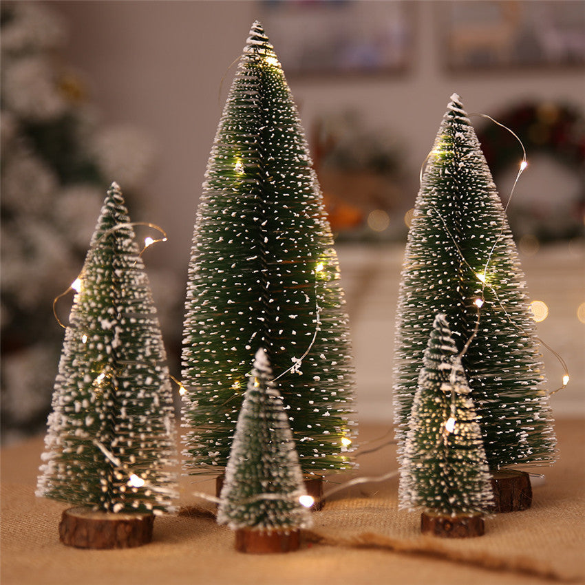 Small green and white pine Christmas trees for tabletop decorating