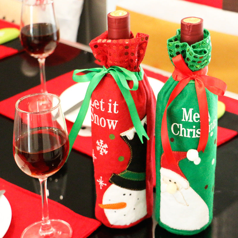 Red snowman cloth Christmas wine bottle cover measuring 4.9 by 11.8 inches
