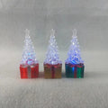 Red plastic Christmas tree ornament molded in the shape of a gift box