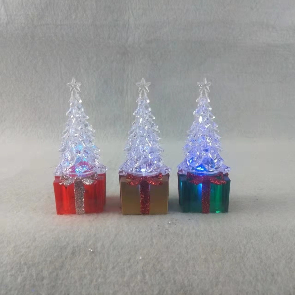Red plastic Christmas tree ornament molded in the shape of a gift box
