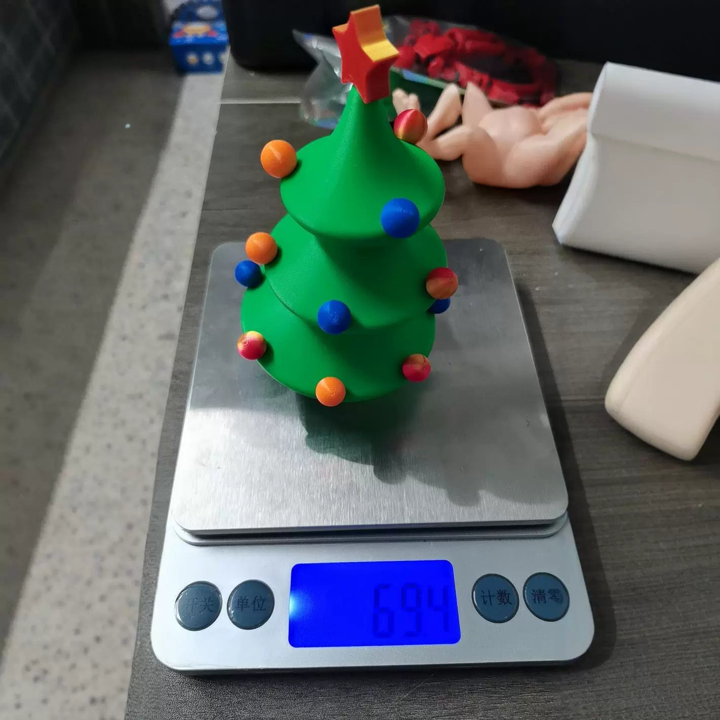One piece printed Christmas tree figure that stands on its own base