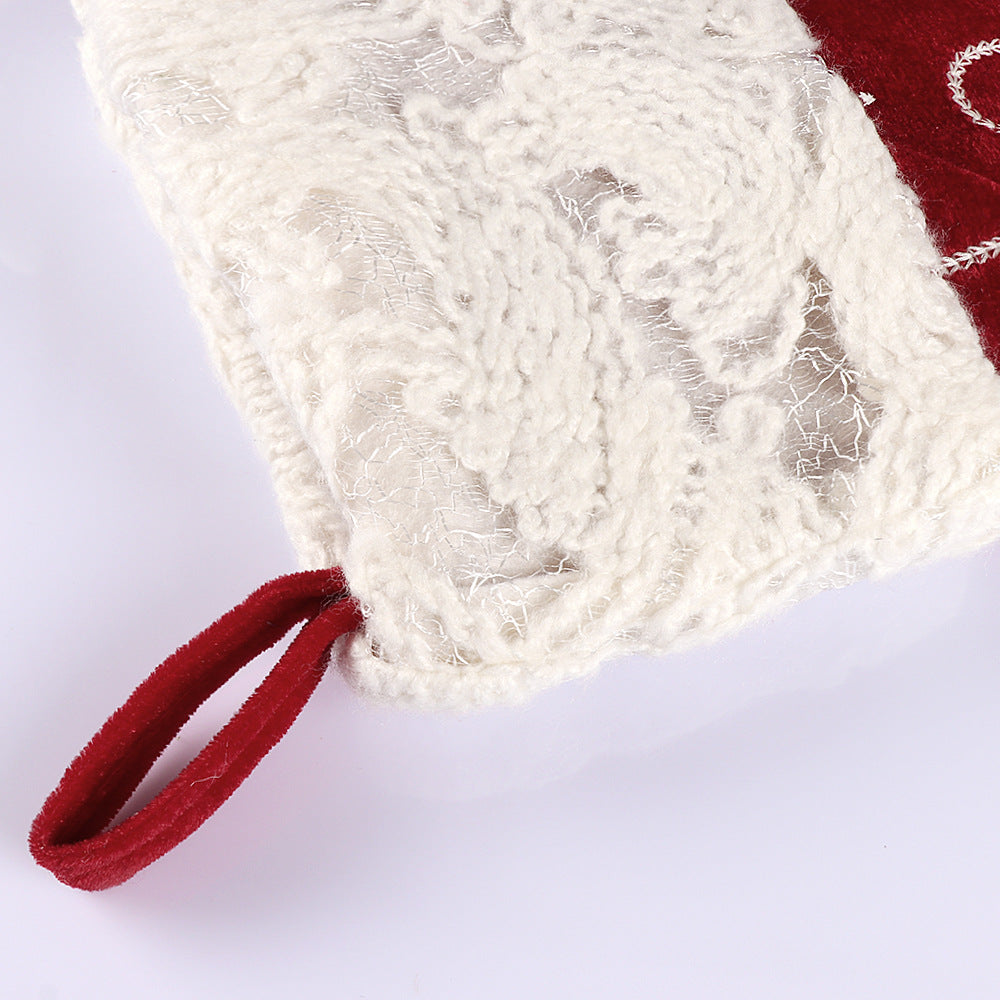 Embroidered snowflake stitching on the velvet Christmas stocking cloth