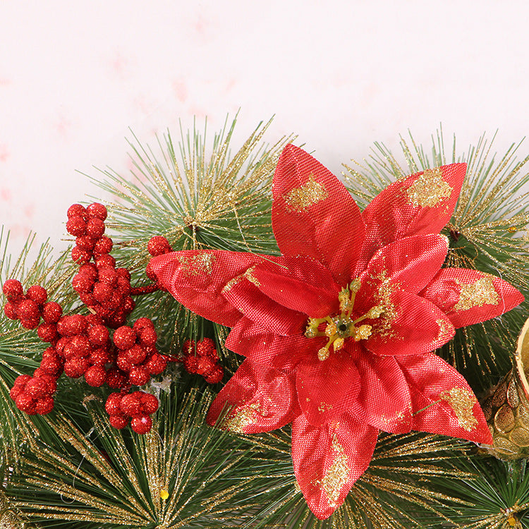 Christmas wreath mixing pine, pine cones, berries and cream colored clover