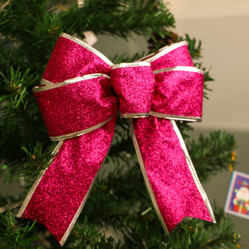 Silver glitter Christmas bow measuring 9.4 by 8.3 inches