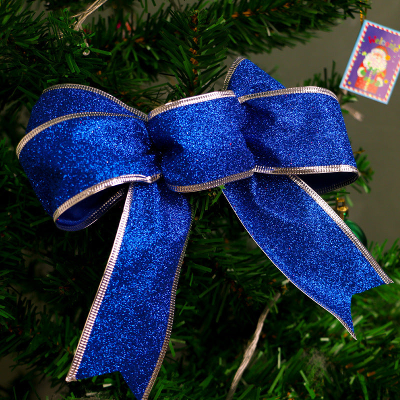 Red ribbon Christmas bow with a light-catching glitter face